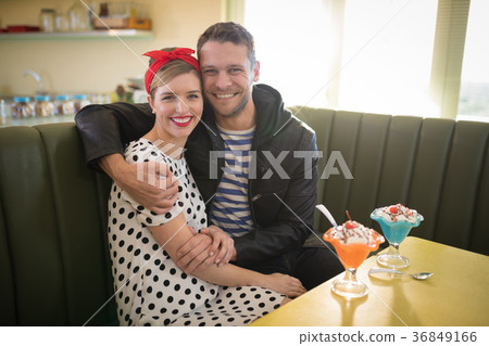 Couple romancing in restaurant Couple romancing in restaurant 36849166