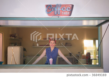 Woman standing in coffee shop Woman standing in coffee shop 36849169