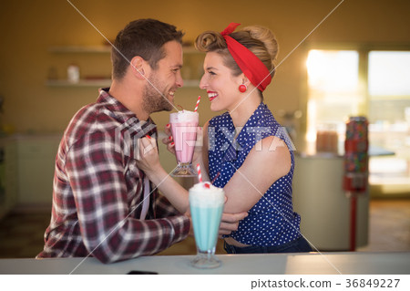 Couple romancing in restaurant 36849227