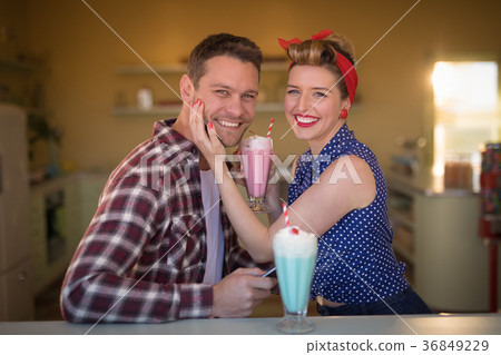 Couple romancing in restaurant 36849229