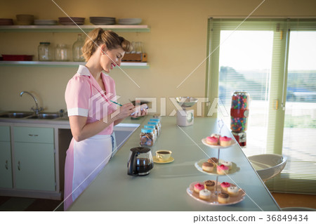 Waitress taking order in restaurant 36849434