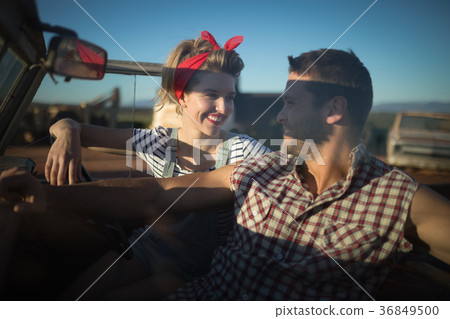 Couple interacting with each other in a car 36849500