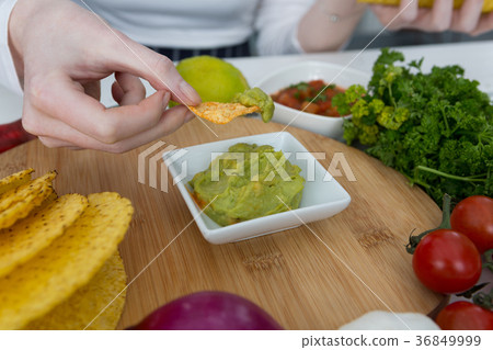 Woman eating mexican food 36849999