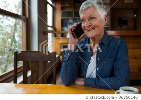 Senior woman talking on mobile phone 36850140