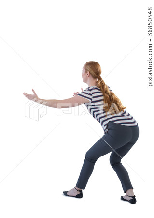 Woman pretending to hold an invisible object Woman pretending to hold an invisible object 36850548