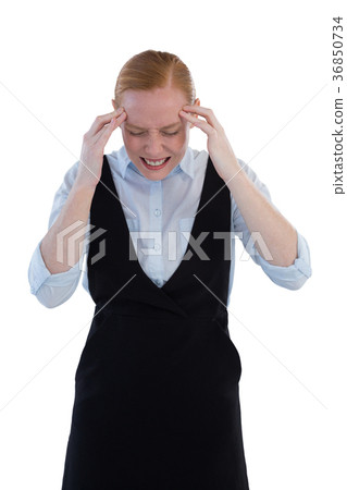 Female executive suffering from headache Female executive suffering from headache 36850734