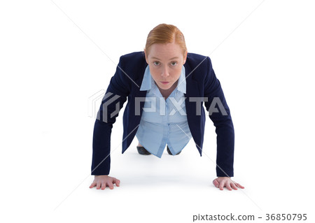 Businesswoman performing push ups Businesswoman performing push ups 36850795