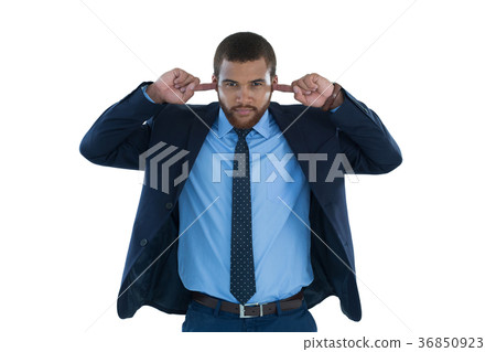 Businessman covering his ears 36850923