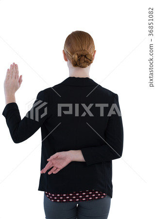 Businesswoman taking oath with fingers crossed 36851082