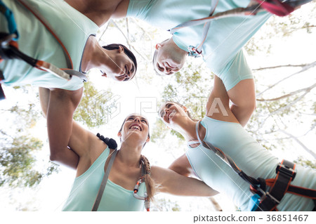 Happy friends forming huddle 36851467