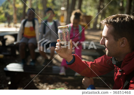 Teacher experimenting soil in park 36851468