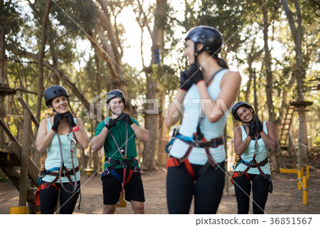 Coach interacting with trainee while wearing protective helmet 36851567