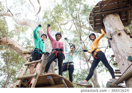 Friends having fun in adventure park Friends having fun in adventure park 36851624