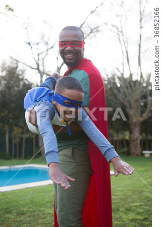 Son and father pretending to be a superhero Son and father pretending to be a superhero 36852166