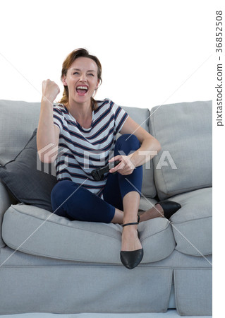 Woman playing video game against white background 36852508