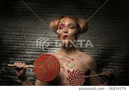 Nude blonde with lollipops in her hands Nude blonde with lollipops in her hands 36854579