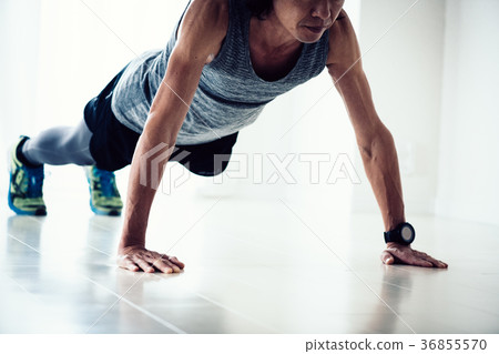 Middle-aged man doing push-ups 36855570