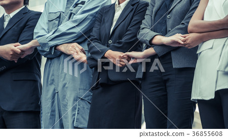 Business people holding hands showing teamwork. 36855608