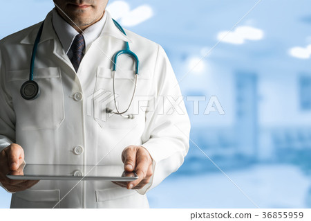 Male Doctor Holding Tablet Computer Male Doctor Holding Tablet Computer 36855959