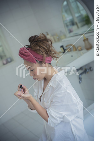 Woman enjoying nail image Woman enjoying nail image 36857267