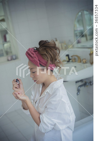 Woman enjoying nail image Woman enjoying nail image 36857334