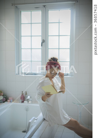 Woman relaxing in the bathroom Woman relaxing in the bathroom 36857418