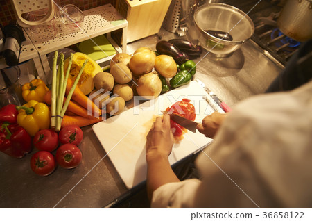 Staff cooking in a cafe kitchen Staff cooking in a cafe kitchen 36858122