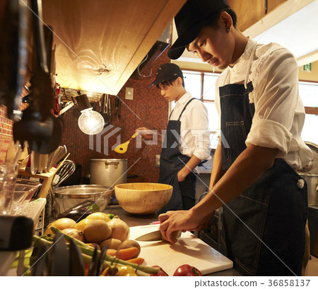Cafe kitchen staff cooking 36858137