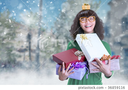 Portrait of asian woman holding many xmas gift box Portrait of asian woman holding many xmas gift box 36859116