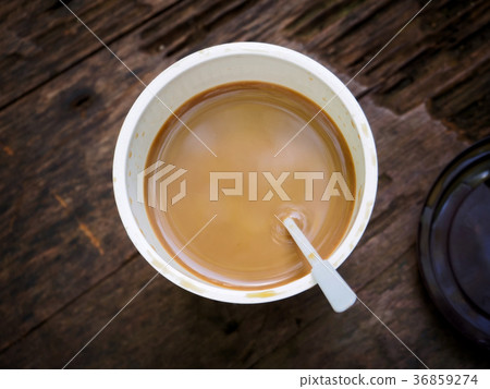 Cup of coffee on wooden table, top view Cup of coffee on wooden table, top view 36859274