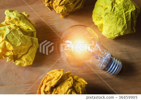 concept crumpled paper around light bulb concept crumpled paper around light bulb 36859905