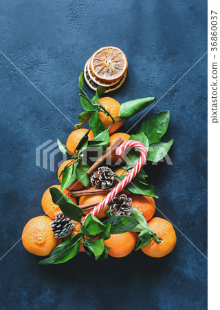 Christmas tree with tangerines, candy cane, spices 36860037