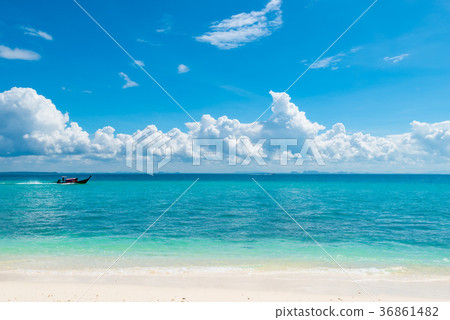 wooden boat long tail in the azure sea wooden boat long tail in the azure sea 36861482