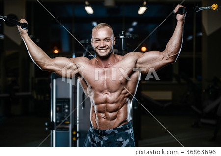Brutal strong bodybuilder athletic men pumping up muscles with d Brutal strong bodybuilder athletic men pumping up muscles with d 36863696
