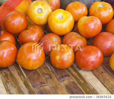 Tomato on a bamboo table Tomato on a bamboo table 36865618