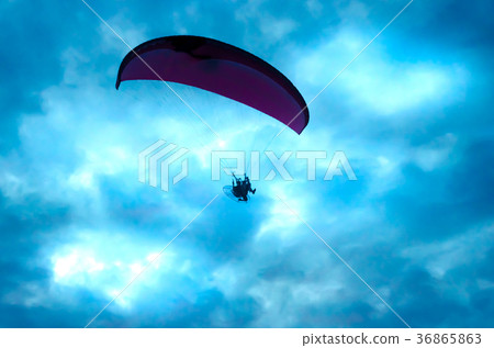 Botton up view of a paraglider flying Botton up view of a paraglider flying 36865863