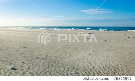 Wavy sand on the beach due to winds 36865961