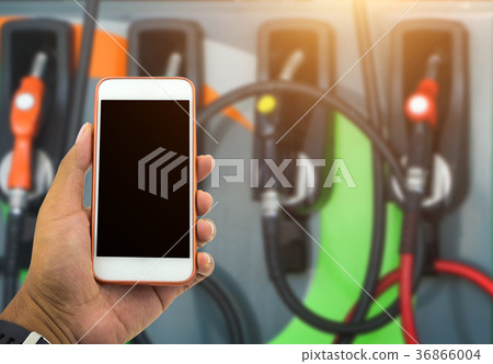 hand hold smartphone and checking fuel  price 36866004