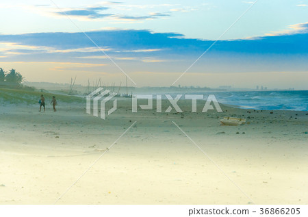 Couple on the beach at the sunset Couple on the beach at the sunset 36866205