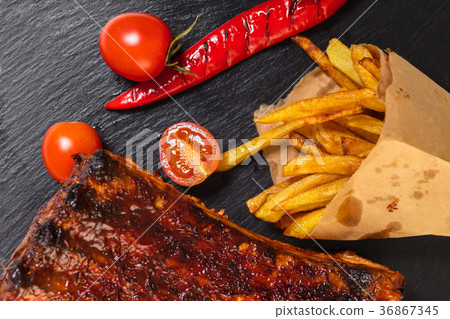 grilled ribs with fries grilled ribs with fries 36867345