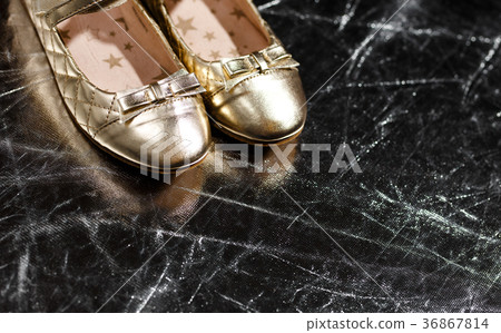 Golden ballet shoes on silver background 36867814