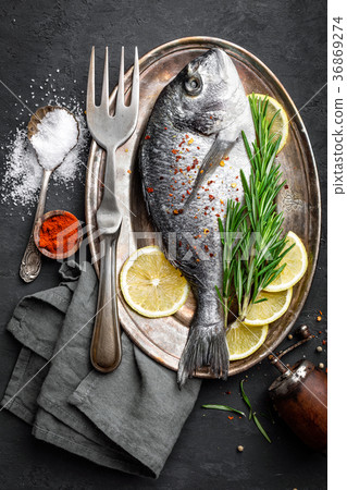 Fresh raw dorado fish with ingredients for cooking 36869274