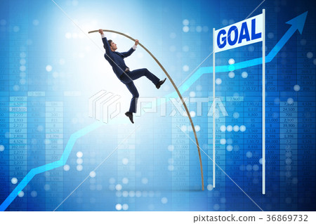 Businessman pole vaulting towards his goal in 36869732