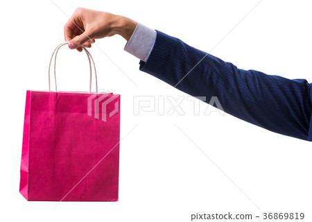 Hand holding shopping bags with christmas shopping Hand holding shopping bags with christmas shopping 36869819