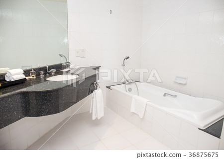 basin and bathtub with shower in white bathroom basin and bathtub with shower in white bathroom 36875675