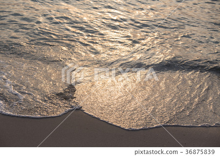 sunrise reflect on wave and beach of tropical sea 36875839