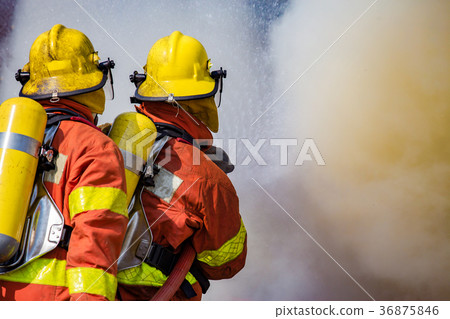 two firefighters water spray high pressure nozzle 36875846
