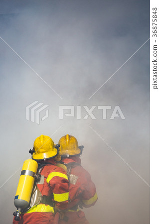 two firefighters water spray high pressure nozzle 36875848