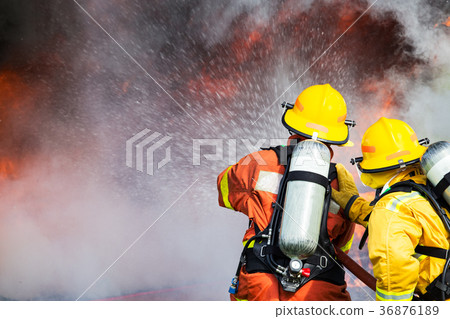firefighters water spray by high pressure nozzle  36876189