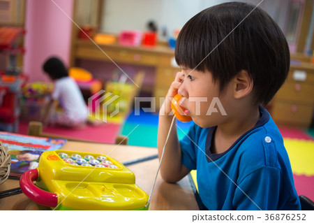 4 years old Asian boy playing toy phone 36876252